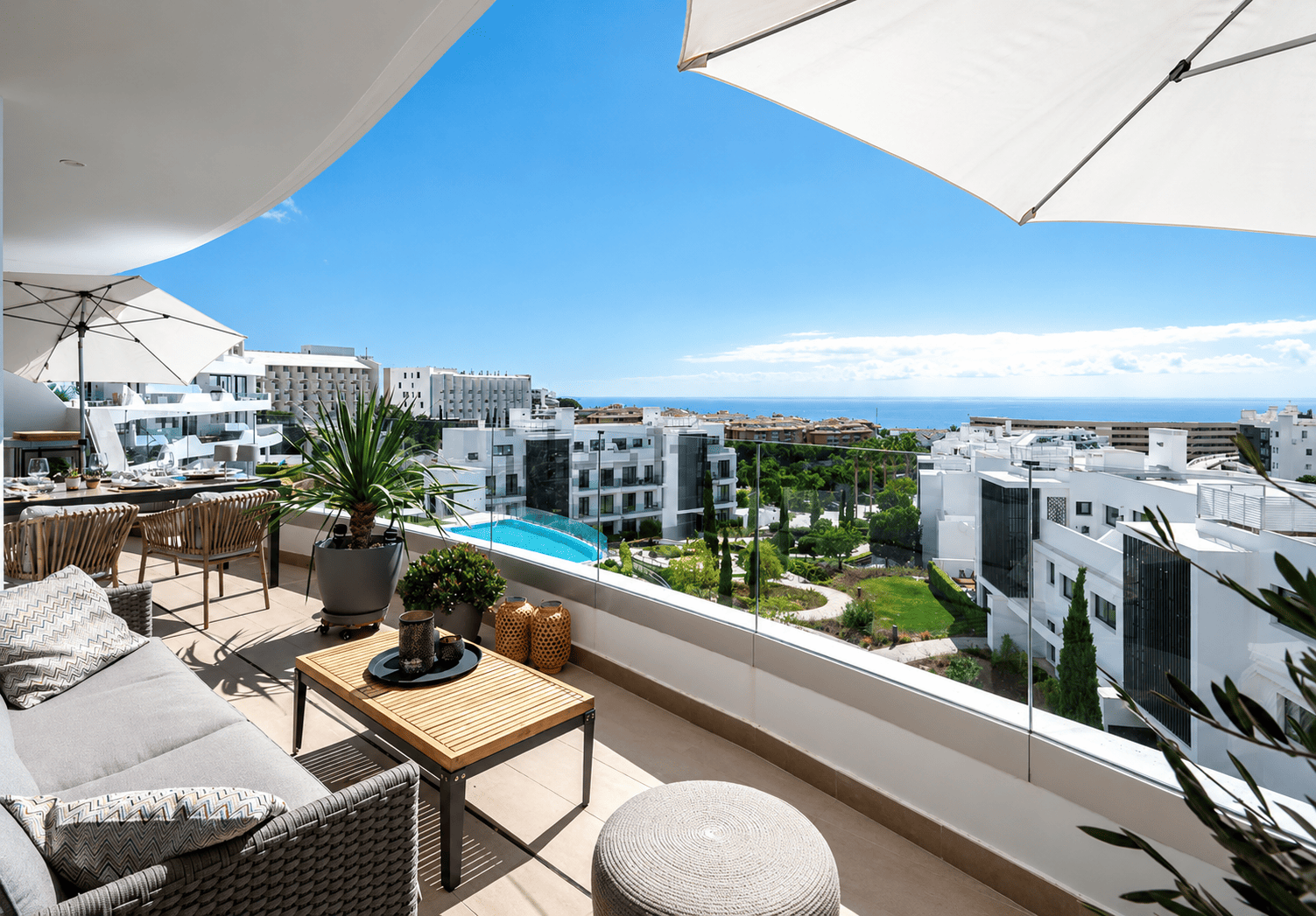 Terrace with sea views, sun umbrellas and lounge seating